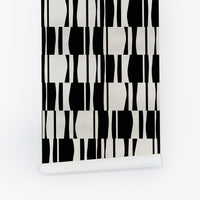 Black and white abstract geometric silk wallpaper with bold bowling-pin shape pattern