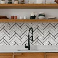 classic backsplash design with herringbone pattern