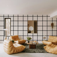 Cream wallpaper with a black hand-drawn oversized windowpane grid