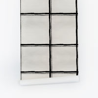 Black hand-drawn oversized grid plaid wallpaper roll close-up