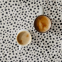 linen fabric with cheetah print design in neutral colors