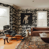 Black and cream floral wallpaper with bold vintage botanical bloom pattern