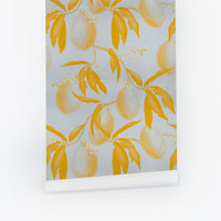 Gray-blue peel and stick wallpaper with golden yellow lemon branches and leaves