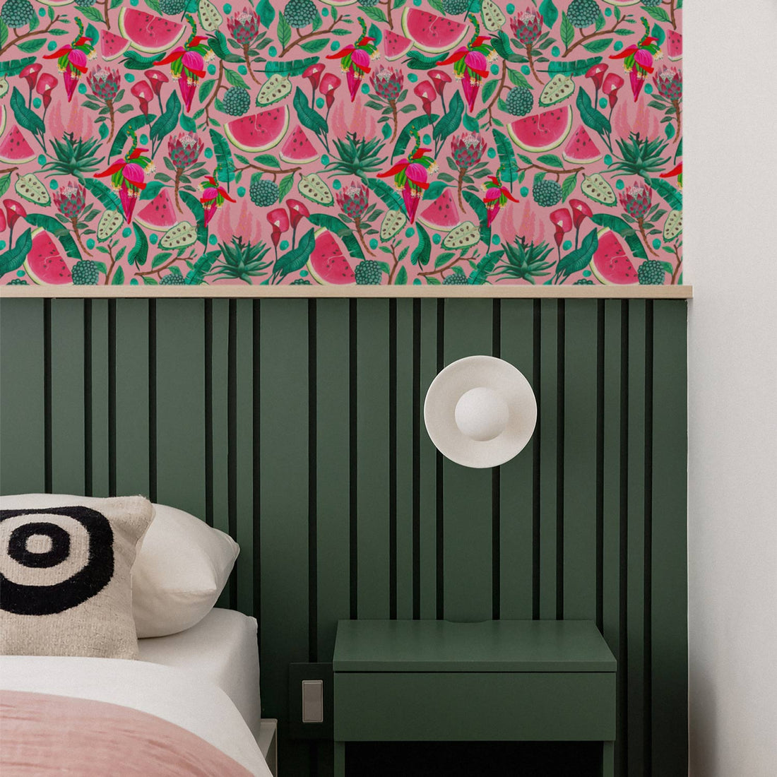 elegant bedroom in green with african artwork on walls