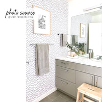 Minimal farmhouse design kids bathroom interior with grey spots wallpaper accent wall