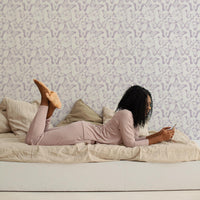 White teen room interior with lavender color butterflies wallpaper accent wall