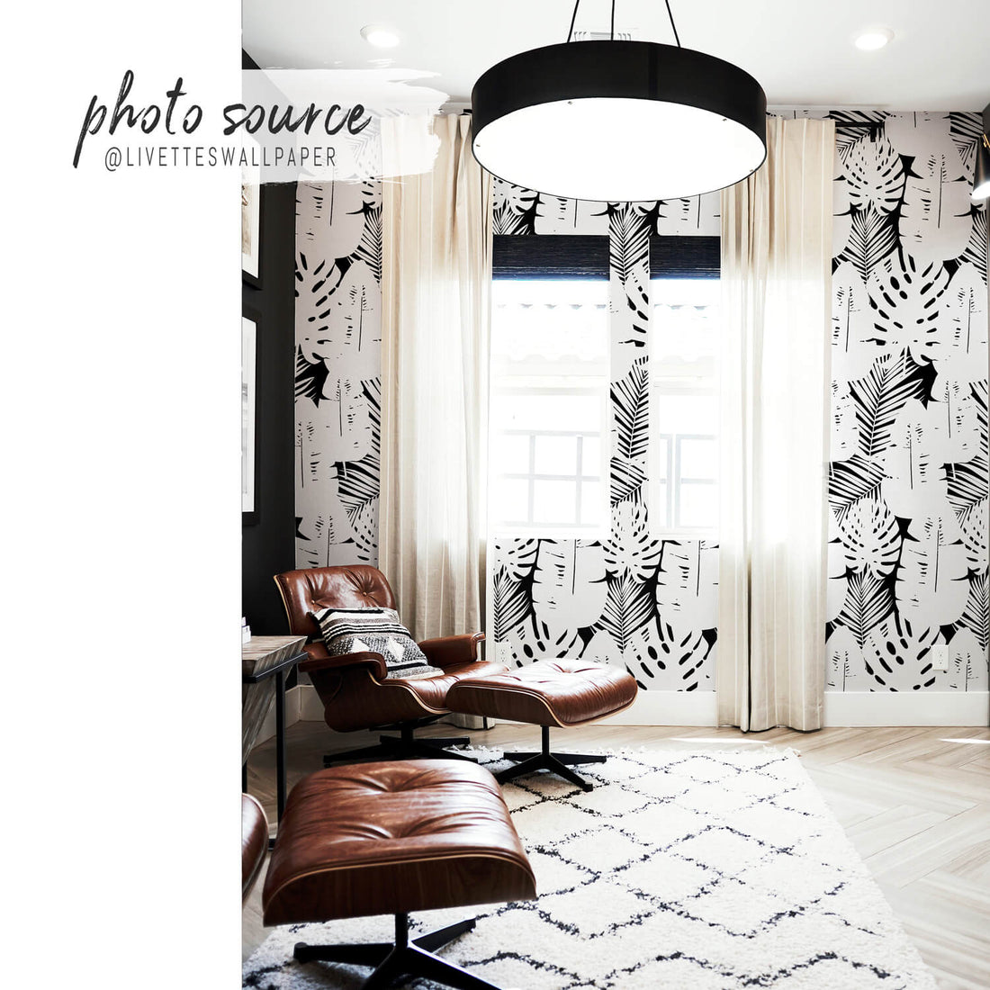 modern neutral living room interior with bold tropical wallpaper