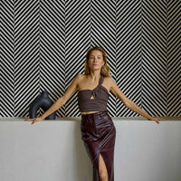 modern bohemian interior with diagonal striped wallpaper pattern