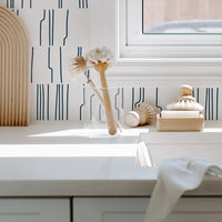 light blue line print laundry room backsplash
