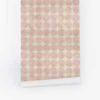 Pastel pink peel and stick wallpaper with a retro chic polka dot pattern