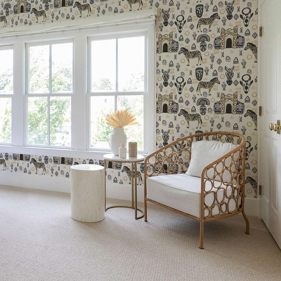 white nursery interior in african style with safari print wallpaper