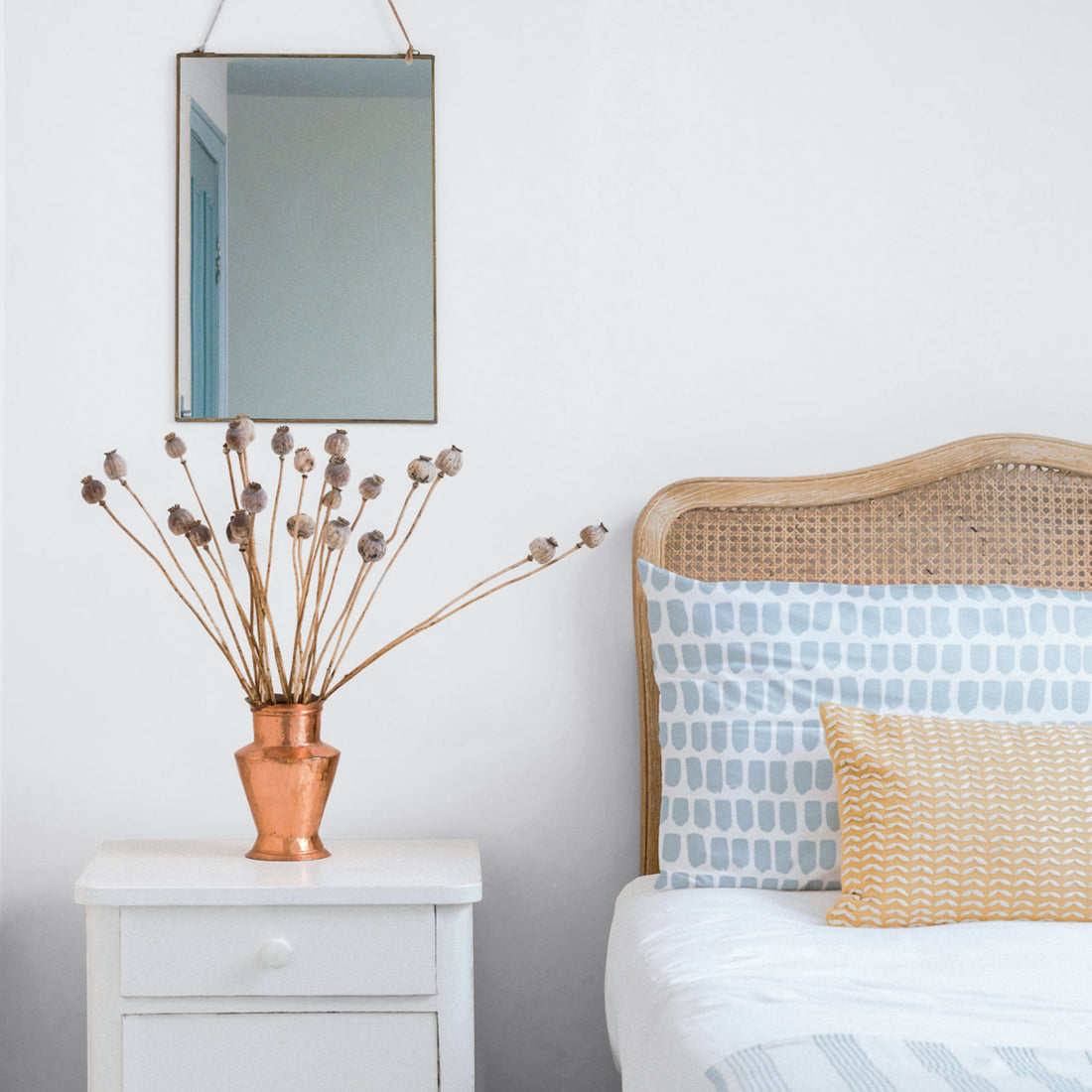 light blue coastal interior with fabric printed pillow