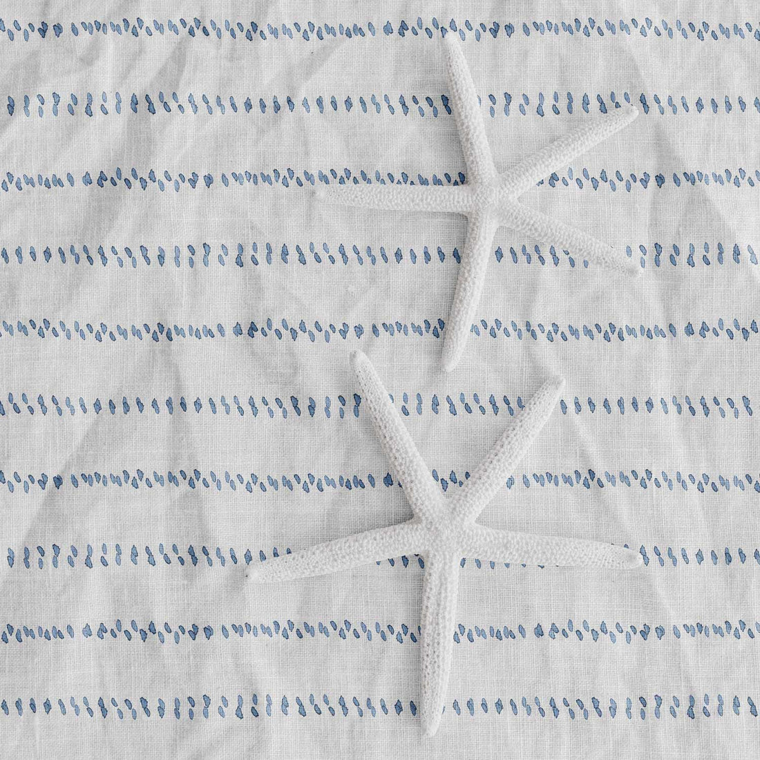 light blue coastal fabric with tiny dots