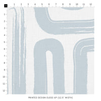 light blue printed fabric close up