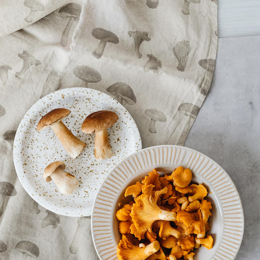 neutral tablecloth with tiny mushrooms