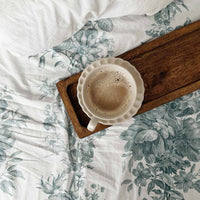 farmhouse style bedroom with green bedsheet cover