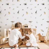 abc pattern wallpaper with animal motif for kids playroom interior