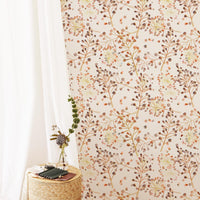 Autumn color palette removable wallpaper in bohemian girl's room with flowers and rattan furniture