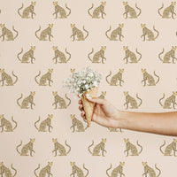 Modern animal print removable wallpaper with blush pink and yellow colors and leopards