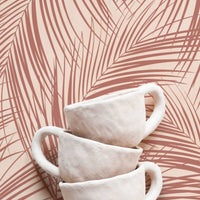 boho kitchen interior with coastal palm leaf motif wallpaper