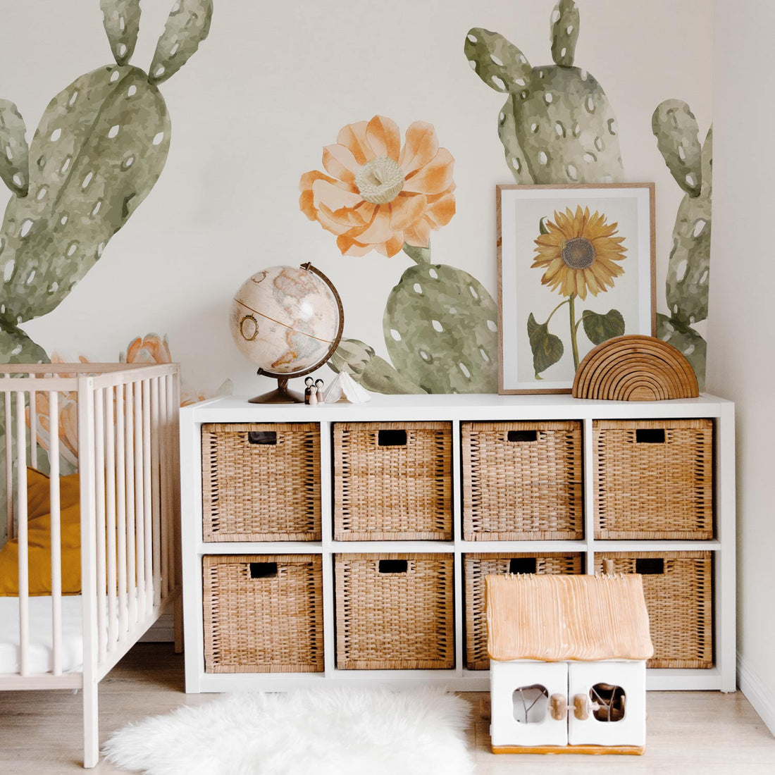Oversized bohemian style cactus wallpaper for kids nursery interior in earth tones