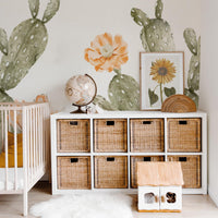 Oversized bohemian style cactus wallpaper for kids nursery interior in earth tones