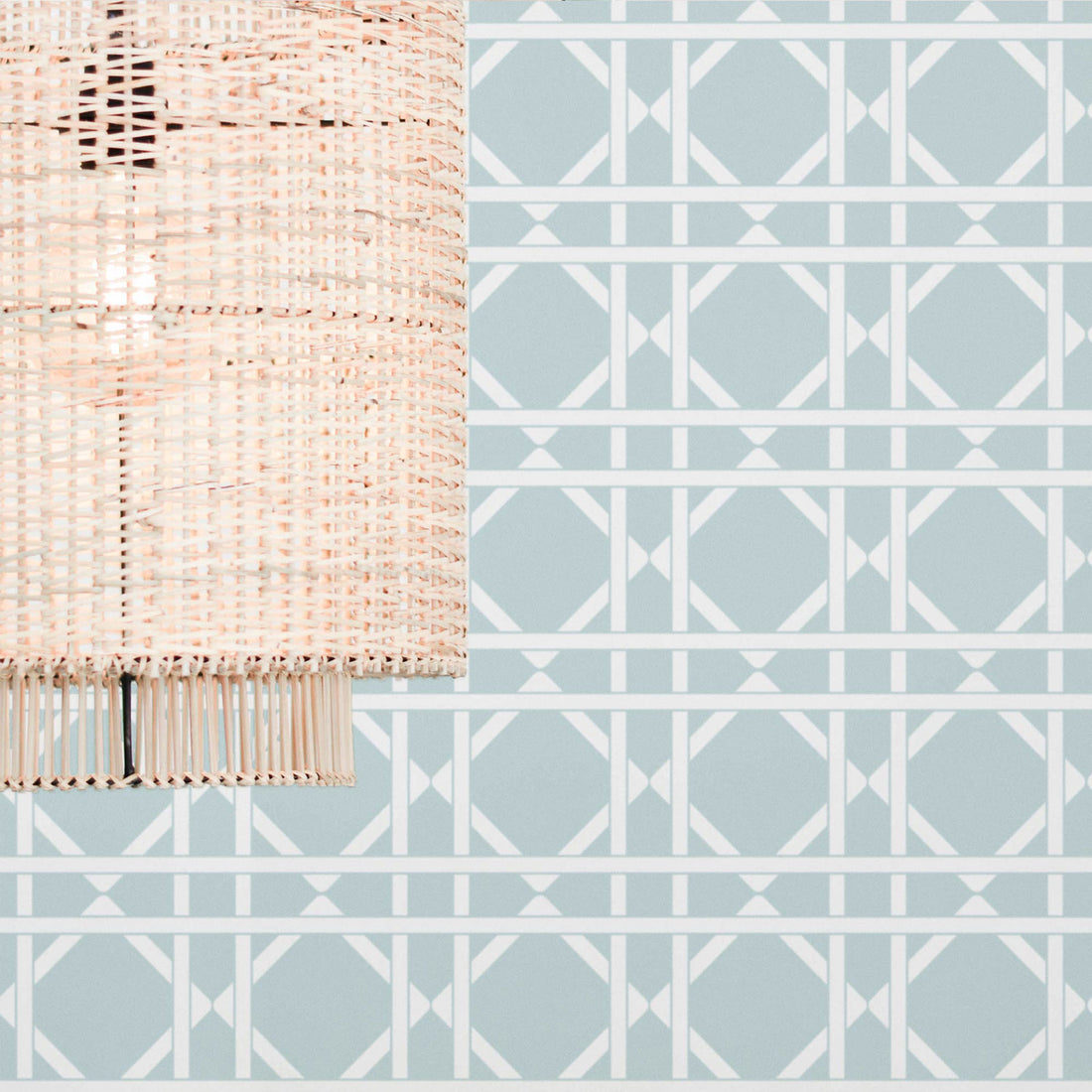 Cane pattern wallpaper in light blue color in boho interior