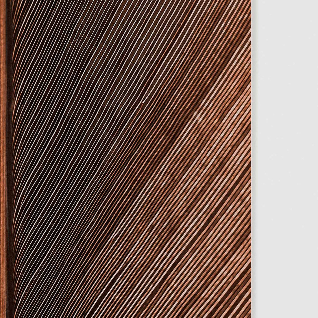 close up of dark leaf motif wall art