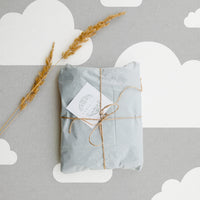 Grey and white clouds removable wallpaper for travel inspired kid's room interior