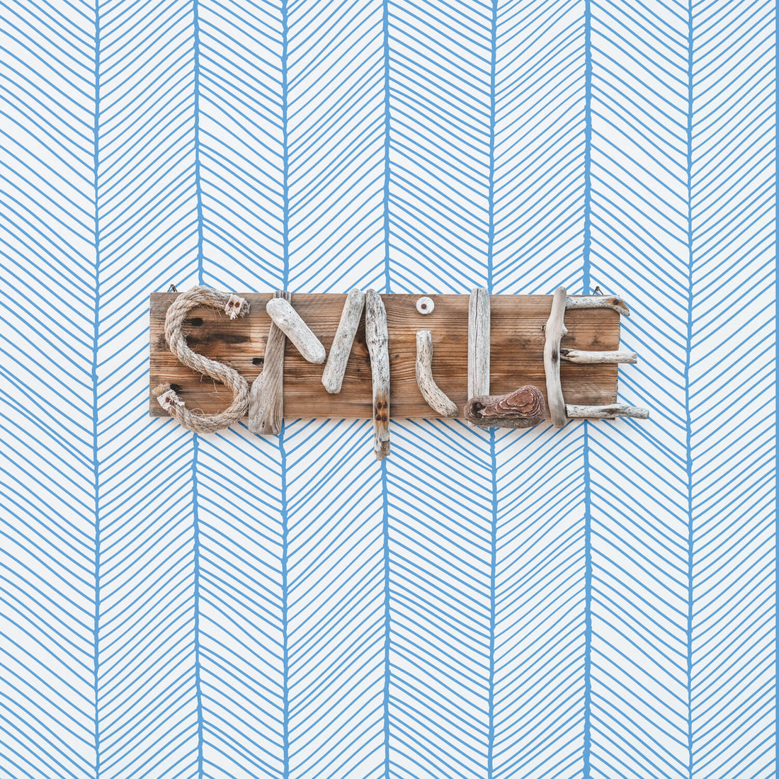 coastal removable wallpaper with blue herringbone design