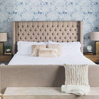 Modern coastal style meets farmhouse bedroom interior with blue tropical removable wallpaper