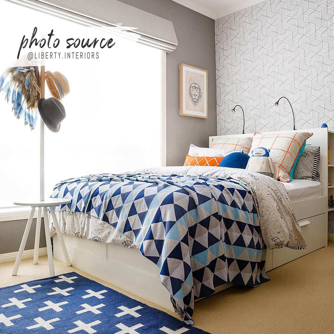 bright boys room interior with striped cube pattern wallpaper