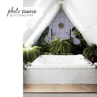 blue and yellow portuguese tiles inspired wallpaper behind bath