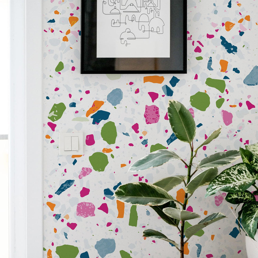 bright large scale terrazzo pattern wallpaper in bright playroom interior