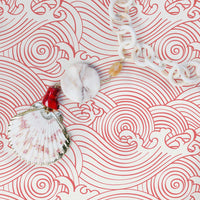 Eclectic beach house interior with pink coastal style wallpaper