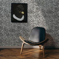 Eclectic living room interior with bold removable wallpaper and wall art