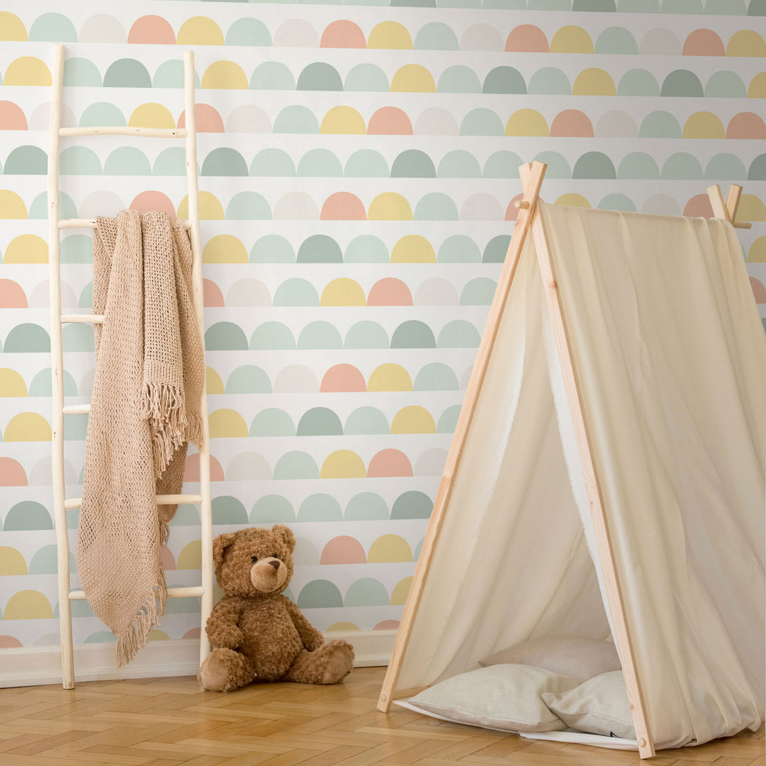 light pastel rainbow colors geometric circles print wallpaper for nursery