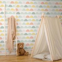 light pastel rainbow colors geometric circles print wallpaper for nursery