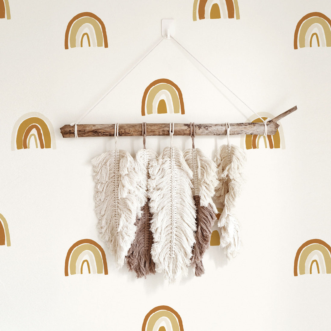 minimal bohemian style decor with tiny rainbow print wallpaper