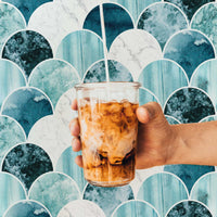 Modern coastal style cafe interior with bold blue marble scallop design feature wallpaper