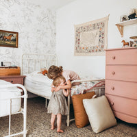 modern bohemian girls bedroom interior with floral design wallpaper