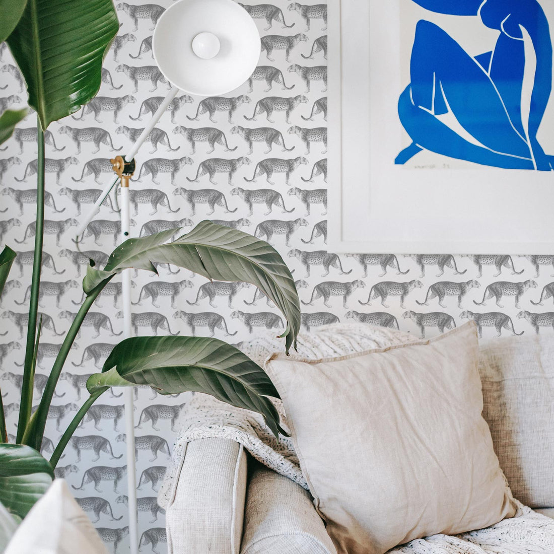 modern bohemian style living room interior with cheetah print wallpaper