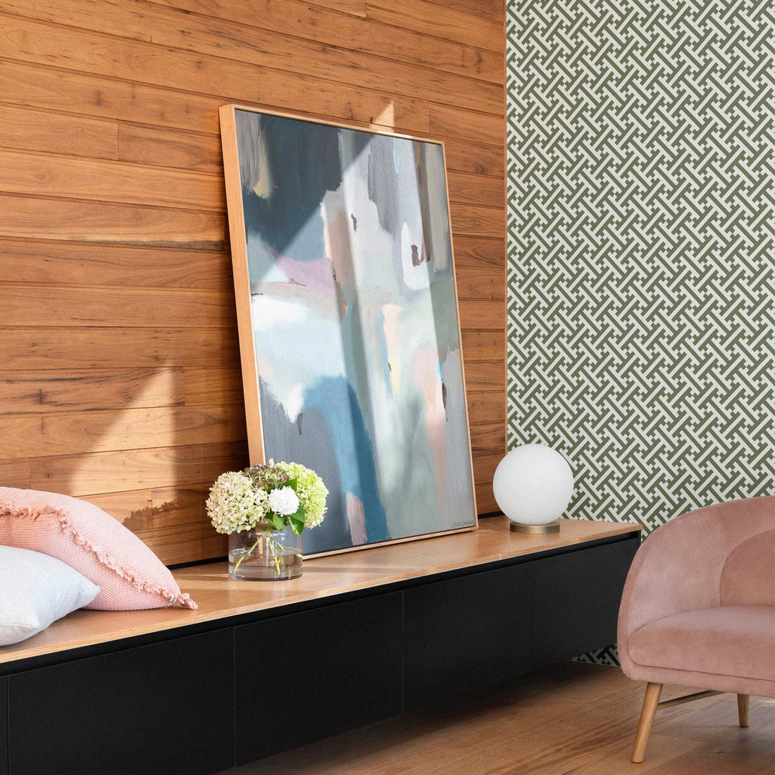 modern living room interior with green patterned wallpaper