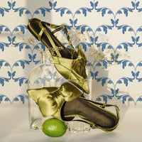 modern chic closet interior design with blue damask print wallpaper