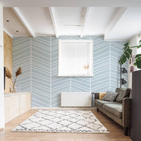 modern coastal living room interior with blue large chevron style lines design wallpaper
