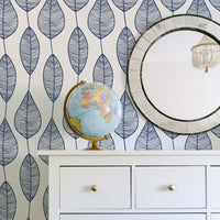 Coastal style living room interior with white furniture and modern blue leaf removable wallpaper