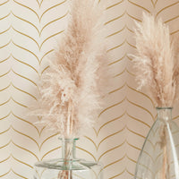 Gold chevron design removable wallpaper in boho style interior with pampas grass decor