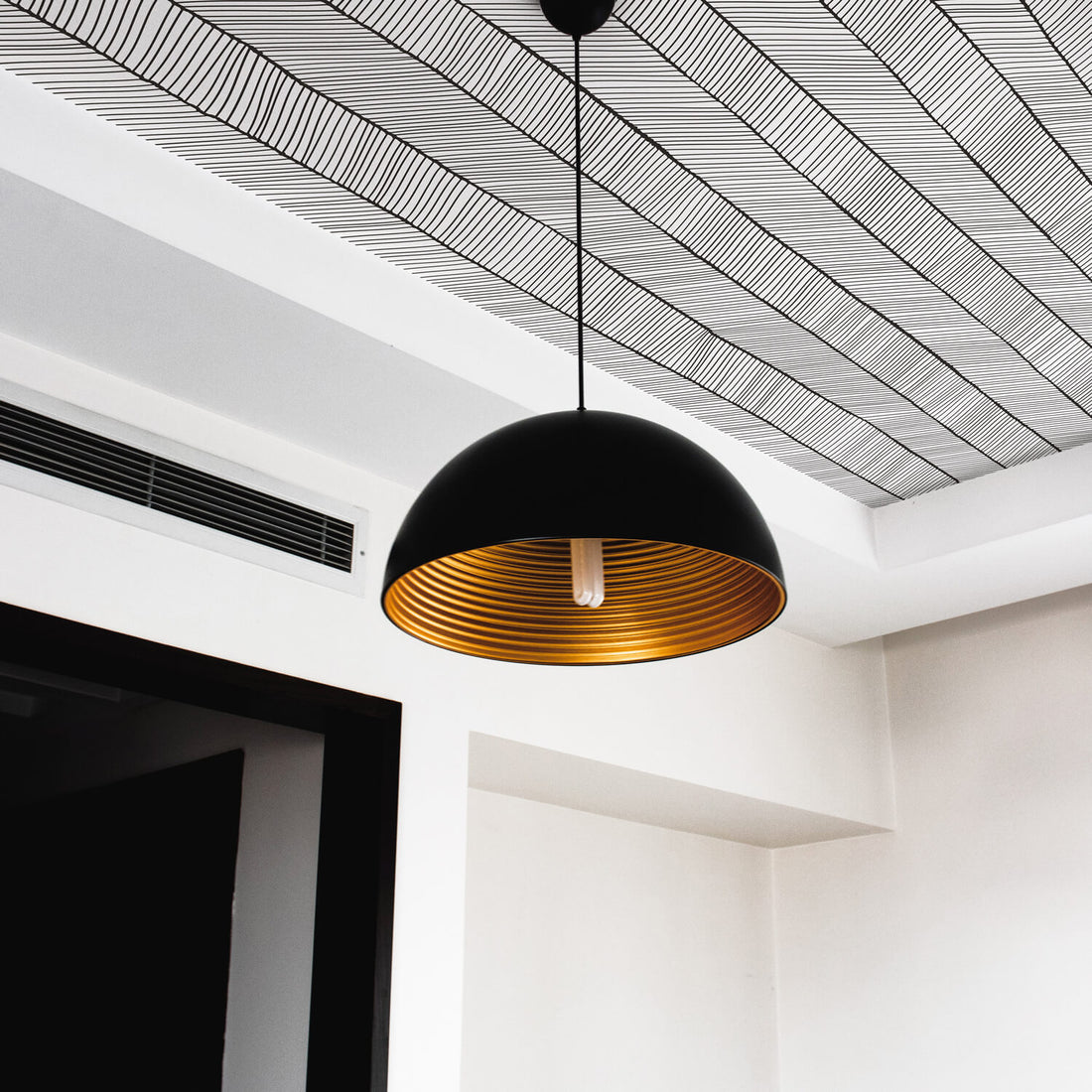 Mid century modern entryway interior with wallpapered ceiling