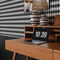 modern home office interior with black diamond shape pattern wallpaper
