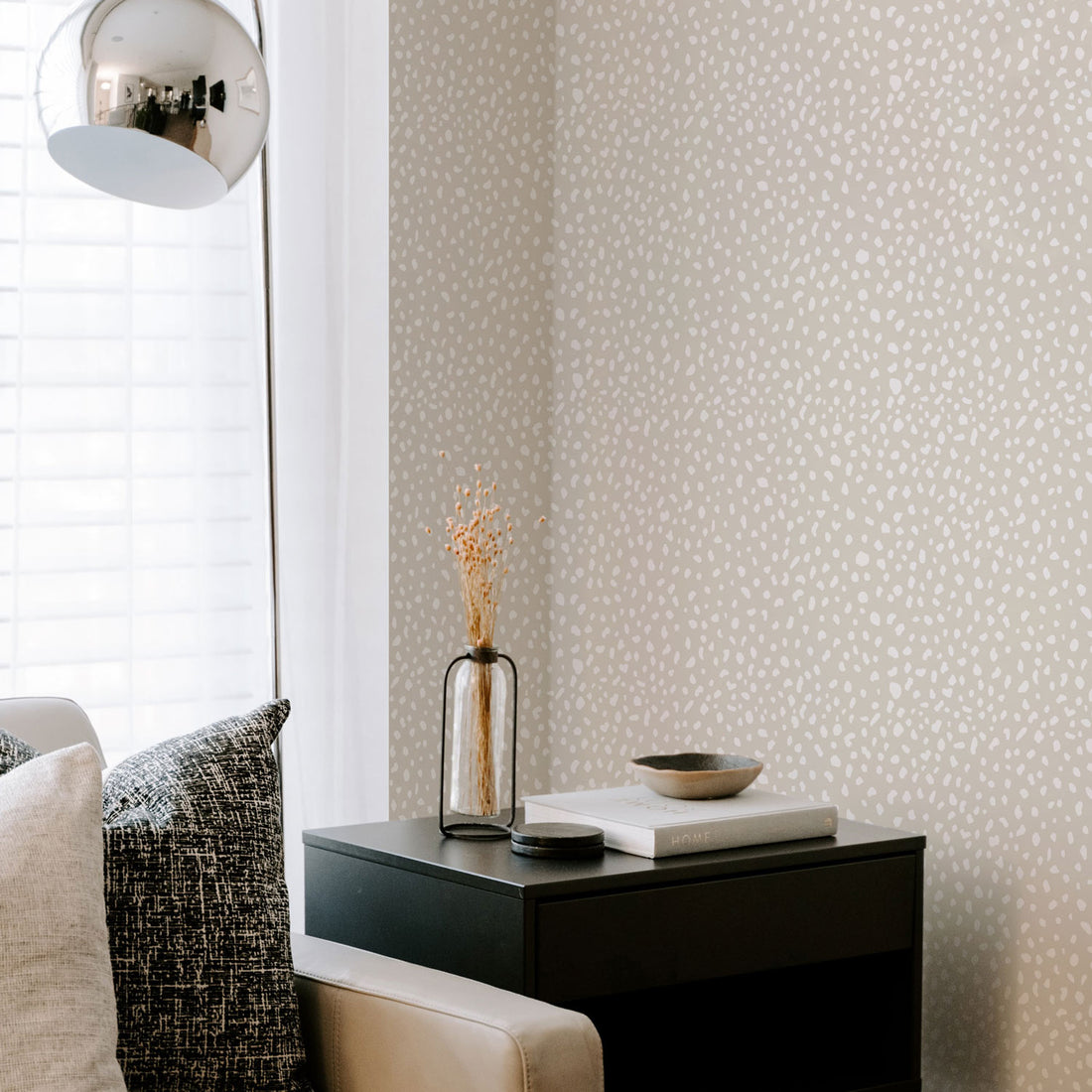 neutral living room interior with animal print wallpaper accent wall